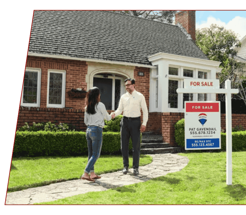 Marketing Plan Real estate agent greeting a person at a house with a RE/MAX 'For Sale' sign outside, symbolizing professional real estate services in Calgary.